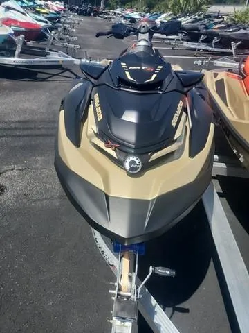 Slide: The Image of 2025 Sea-Doo Waverunner RXT-X on trailer, sleek design, parked outdoors. - 9
