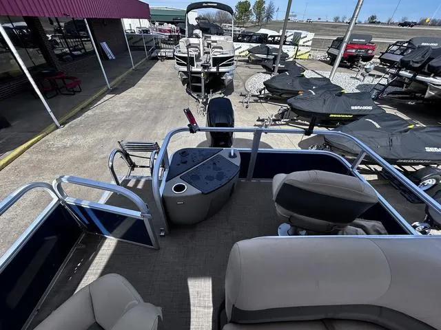 Slide: The Image of 2023 Sun Tracker BASS BUGGY® 18 DLX pontoon boat interior at dealership. - 11