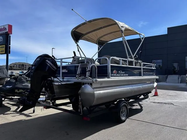 Slide: The Image of 2023 Sun Tracker BASS BUGGY® 18 DLX pontoon boat with canopy on trailer. - 3