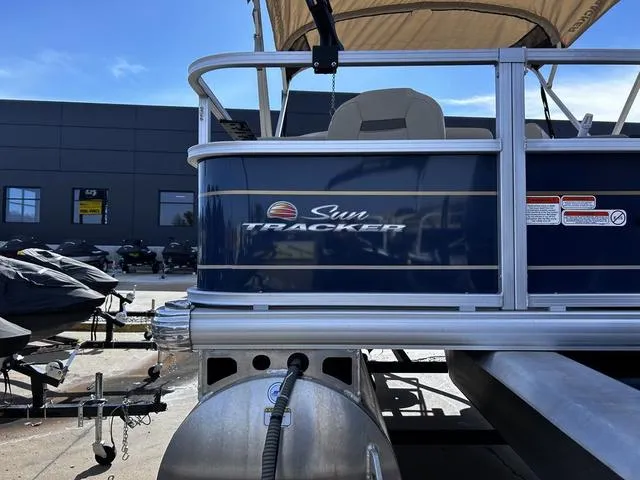 Slide: The Image of 2023 Sun Tracker BASS BUGGY® 18 DLX pontoon boat in a marina setting. - 5