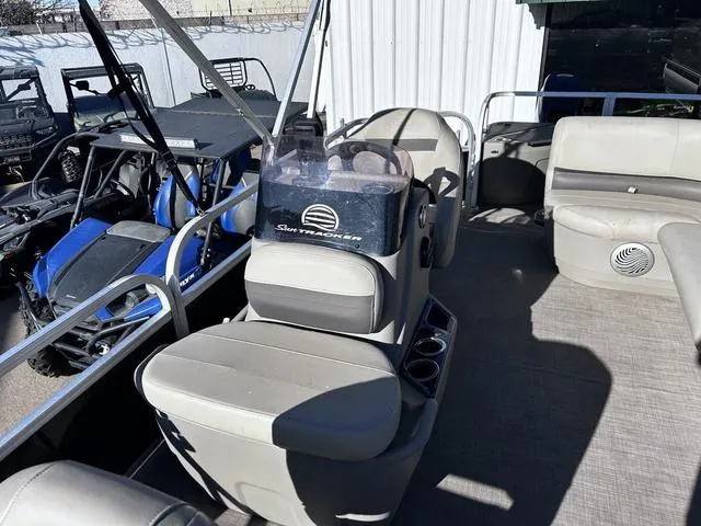 Slide: The Image of 2021 Sun Tracker BASS BUGGY® 18 DLX pontoon boat interior with seating and storage. - 13