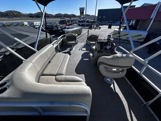 Slide: The Image of 2021 Sun Tracker BASS BUGGY® 18 DLX pontoon boat interior with seating and steering console. - 17