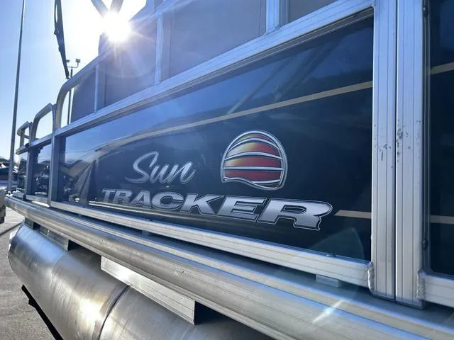 Slide: The Image of 2021 Sun Tracker BASS BUGGY® 18 DLX pontoon boat interior with seating and steering console. - 9