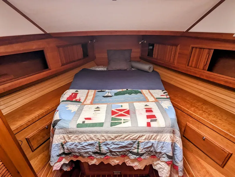 Slide: The Image of Cozy cabin interior of 2003 Sabre 36 Flybridge with nautical-themed quilt. - 26