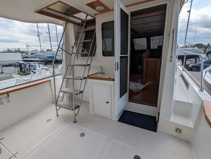 Slide: The Image of 2003 Sabre 36 Flybridge yacht interior with ladder and open door to cabin. - 3