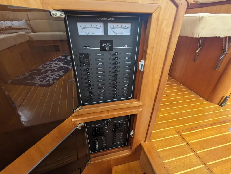 Slide: The Image of Electrical panel on 2003 Sabre 36 Flybridge yacht, featuring wood interior and control gauges. - 30
