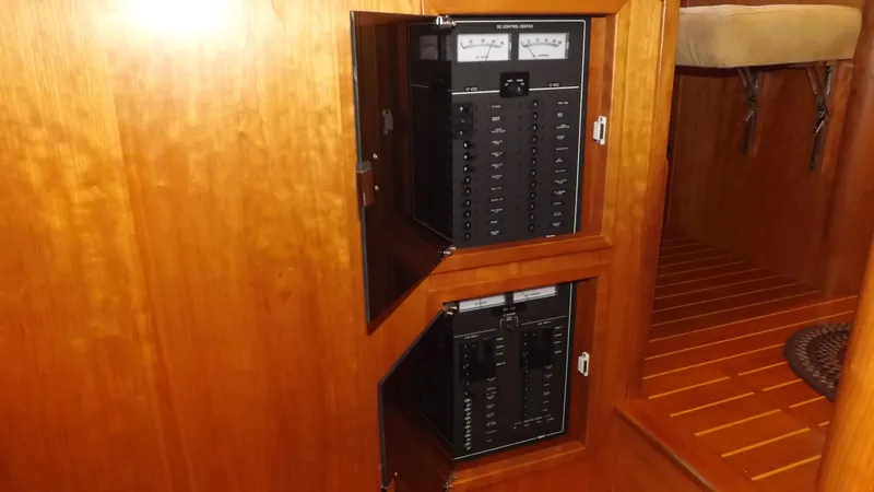 Slide: The Image of Electrical panel inside 2003 Sabre 36 Flybridge yacht with wooden interior. - 31