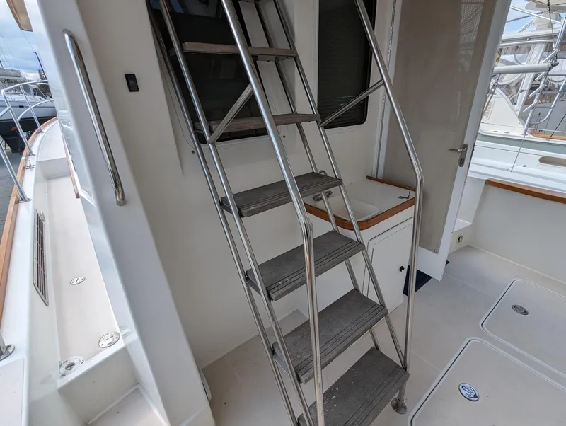 Slide: The Image of Stainless steel ladder on 2003 Sabre 36 Flybridge yacht deck. - 4
