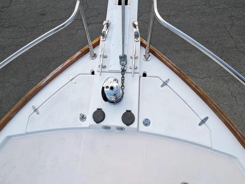 Slide: The Image of Bow of 2003 Sabre 36 Flybridge with anchor chain and deck fittings. - 45