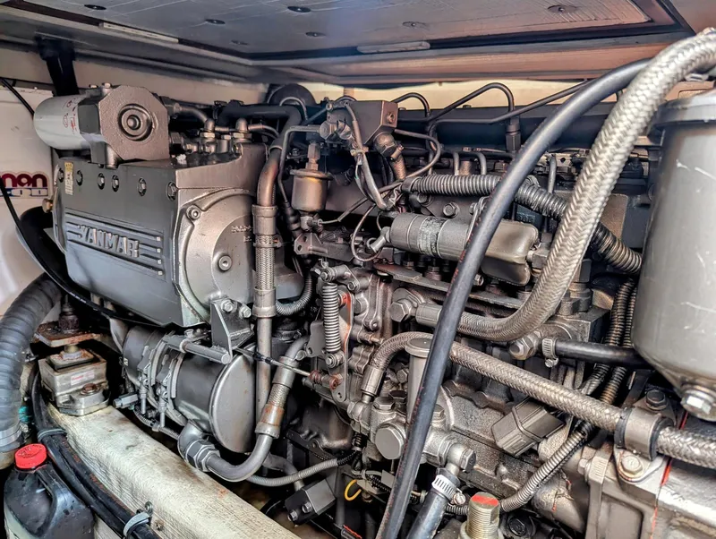 Slide: The Image of Engine of 2003 Sabre 36 Flybridge boat, showcasing intricate mechanical components. - 49