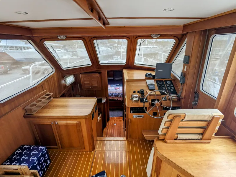Slide: The Image of Interior of 2003 Sabre 36 Flybridge yacht with wooden finish and navigation equipment. - 6
