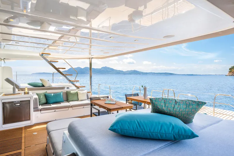 Slide: The Image of Luxurious Lagoon 60 yacht interior, 2025 model, with ocean view and elegant seating area. - 14