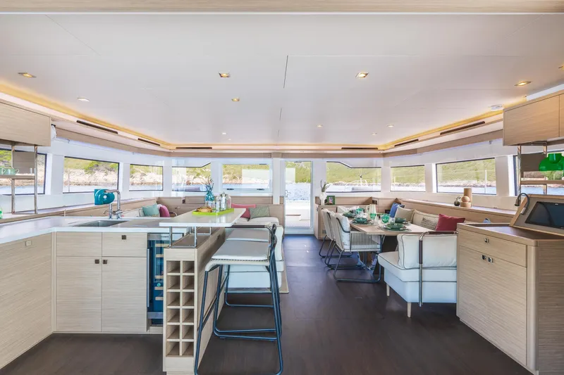 Slide: The Image of Luxurious interior of 2025 Lagoon 60 yacht with modern furnishings and panoramic windows. - 22