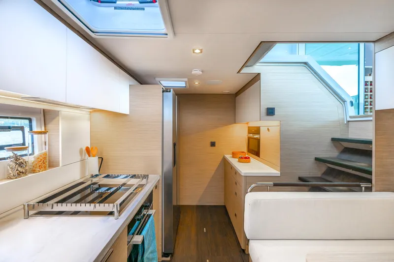 Slide: The Image of Modern kitchen interior of 2025 Lagoon 60 yacht with sleek design and ample natural light. - 28