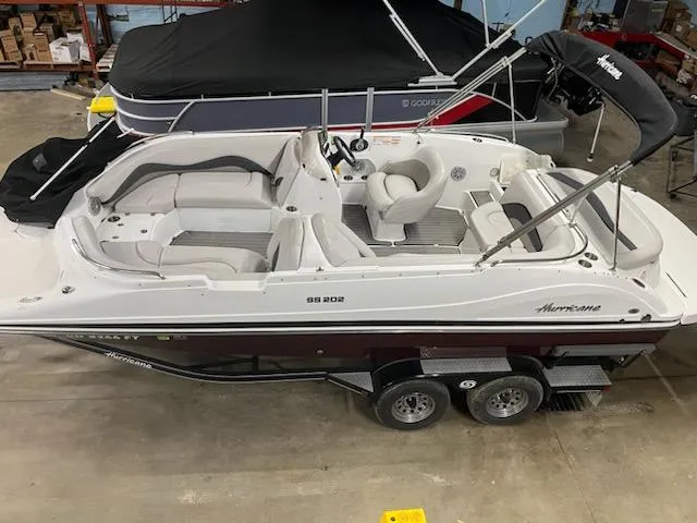 Slide: The Image of 2017 Hurricane SS202 boat on trailer in indoor storage facility. - 17