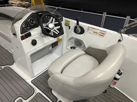 Slide: The Image of 2017 Hurricane SS202 boat cockpit with steering wheel and control panel. - 20