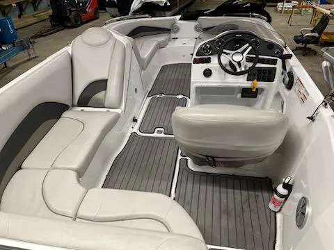Slide: The Image of 2017 Hurricane SS202 boat interior with gray seating and steering console. - 24
