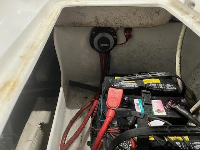 Slide: The Image of Battery compartment of a 2017 Hurricane SS202 boat with wiring and connections. - 26