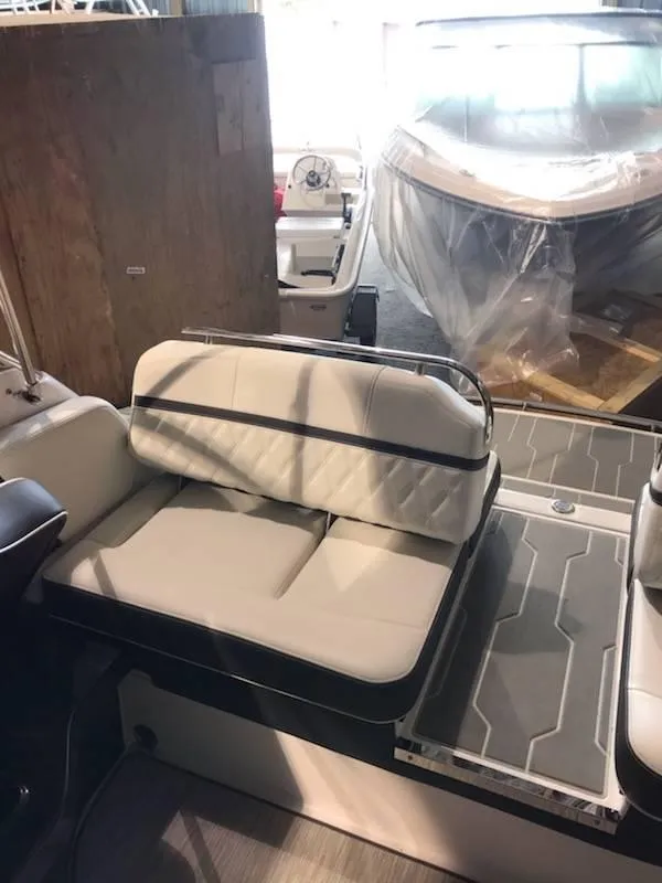 Slide: The Image of 2018 Regal 2800 Bowrider interior with cushioned seating and modern design. - 11