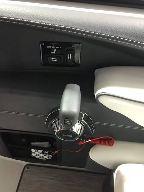 Slide: The Image of 2018 Regal 2800 Bowrider throttle control and seat adjustment panel. - 13