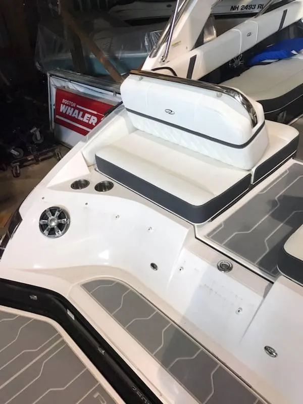 Slide: The Image of 2018 Regal 2800 Bowrider boat interior with seating and cup holders. - 19