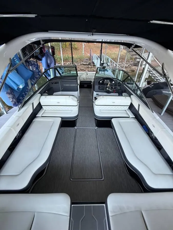 Slide: The Image of 2018 Regal 2800 Bowrider interior with white seating and modern dashboard. - 21