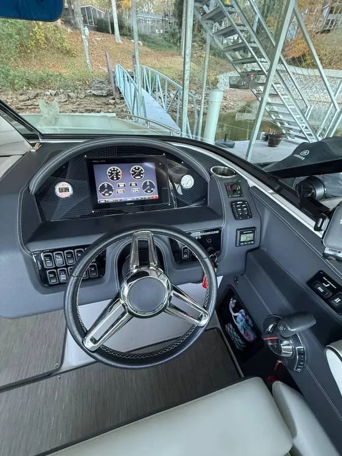 Slide: The Image of 2018 Regal 2800 Bowrider helm with modern controls and digital display. - 22