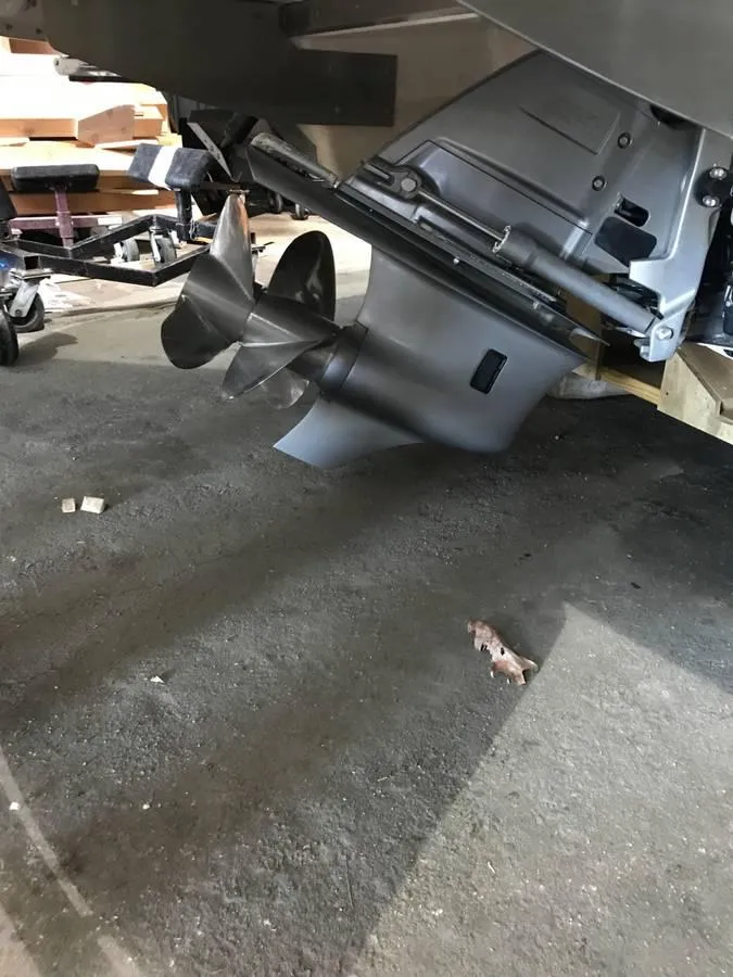 Slide: The Image of Propeller of 2018 Regal 2800 Bowrider boat on a workshop floor. - 6