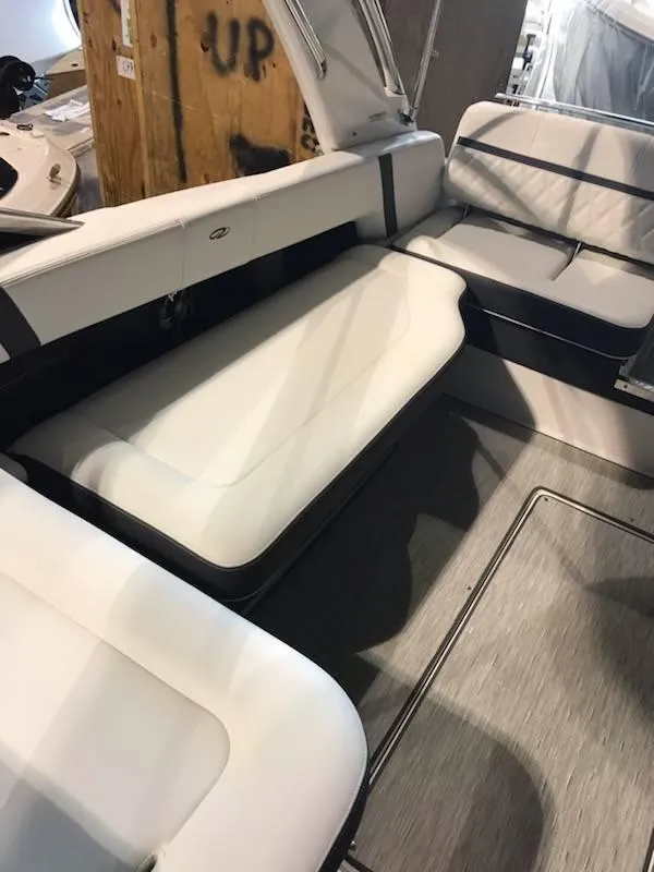 Slide: The Image of 2018 Regal 2800 Bowrider interior with white seating and modern design. - 9