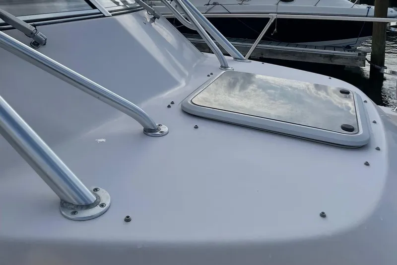 Slide: The Image of 2005 Grady-White Marlin 300 boat deck with hatch and railing. - 6