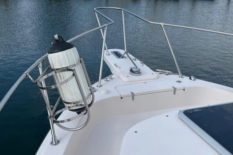 Slide: The Image of Bow of 2005 Grady-White Marlin 300 boat with railing and water view. - 9