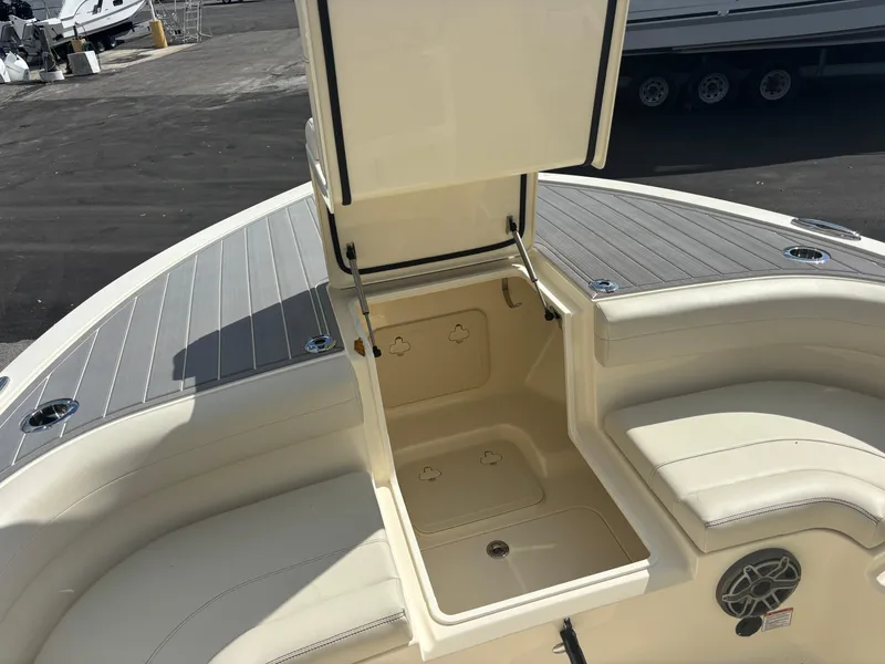 Slide: The Image of 2025 Scout 281 XSS boat interior with open storage compartment. - 19