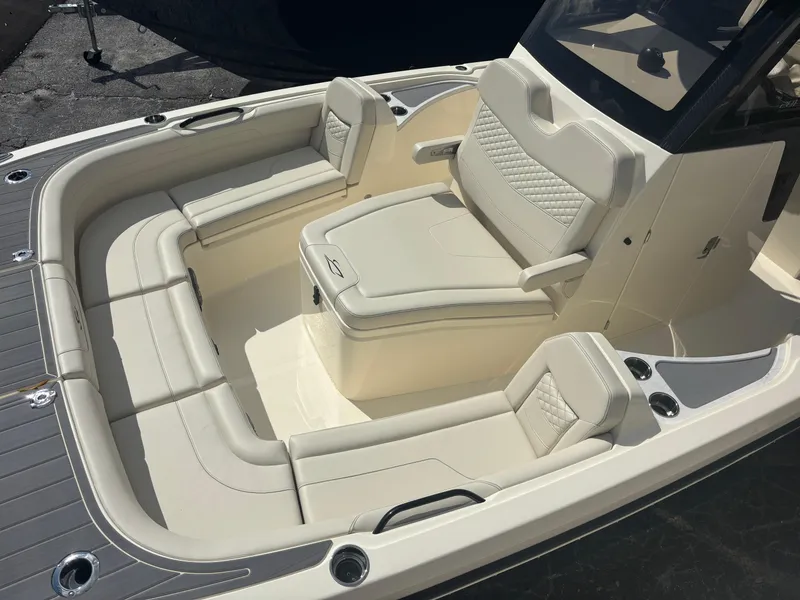 Slide: The Image of 2025 Scout 281 XSS boat interior with luxurious seating and modern design. - 7