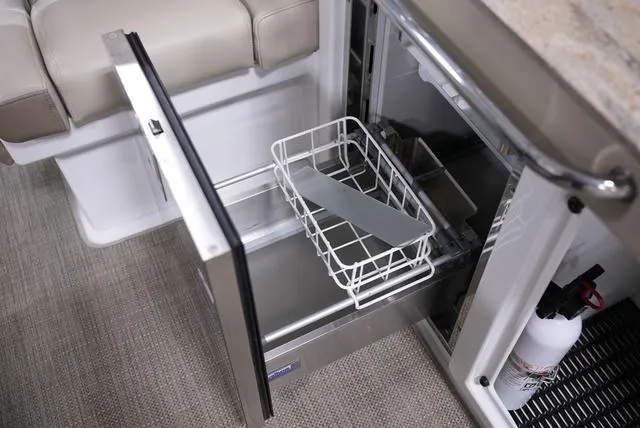 Slide: The Image of Open refrigerator drawer on 2016 Formula Boats 290 Bowrider, showcasing interior storage. - 10