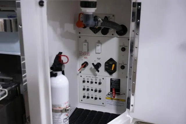 Slide: The Image of Control panel and fire extinguisher inside 2016 Formula Boats 290 Bowrider. - 11