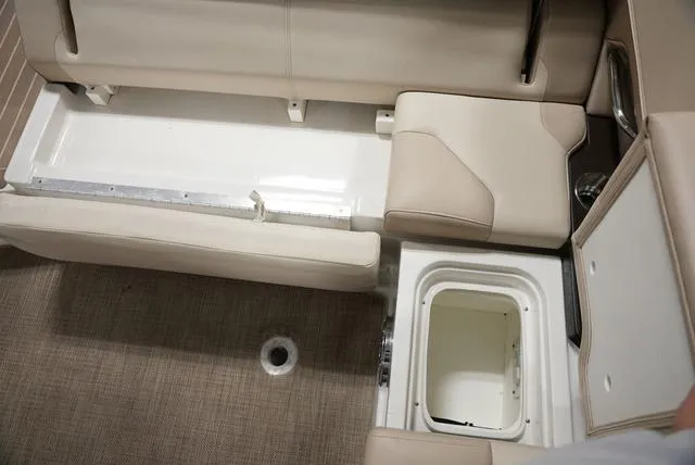 Slide: The Image of 2016 Formula Boats 290 Bowrider interior storage compartments and seating area. - 12