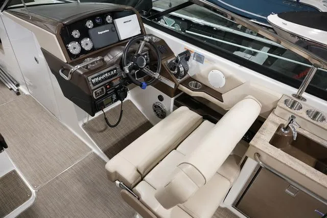 Slide: The Image of 2016 Formula Boats 290 Bowrider cockpit with steering wheel, gauges, and seating. - 14