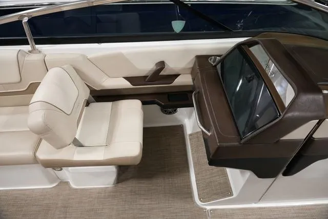 Slide: The Image of 2016 Formula Boats 290 Bowrider interior with beige seating and sleek dashboard design. - 18