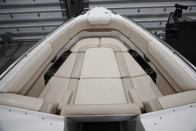 Slide: The Image of 2016 Formula Boats 290 Bowrider interior with beige seating and cup holders. - 26