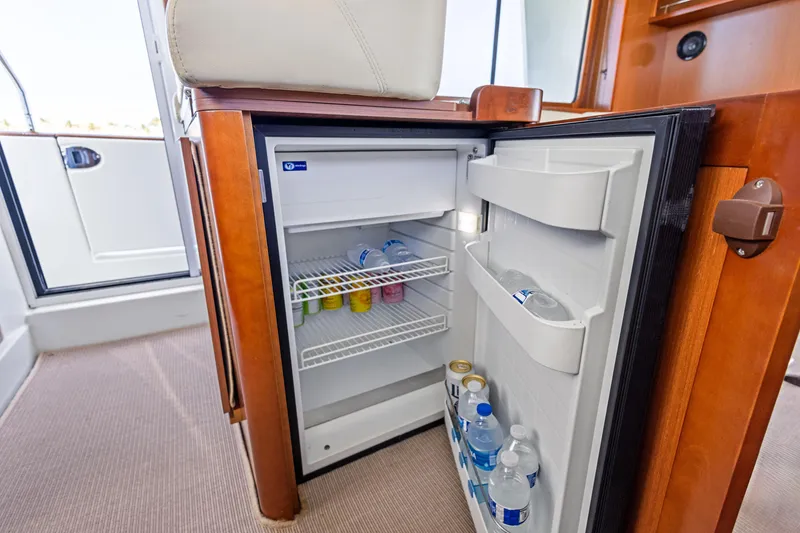 Slide: The Image of Mini fridge stocked with drinks inside a 2012 Beneteau Swift Trawler 44 yacht. - 19