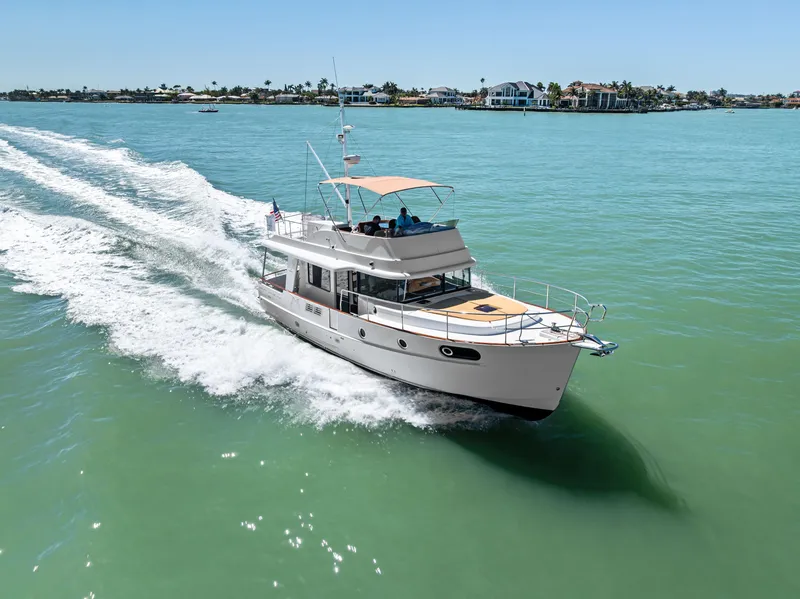 Slide: The Image of 2012 Beneteau Swift Trawler 44 cruising on turquoise waters. - 2