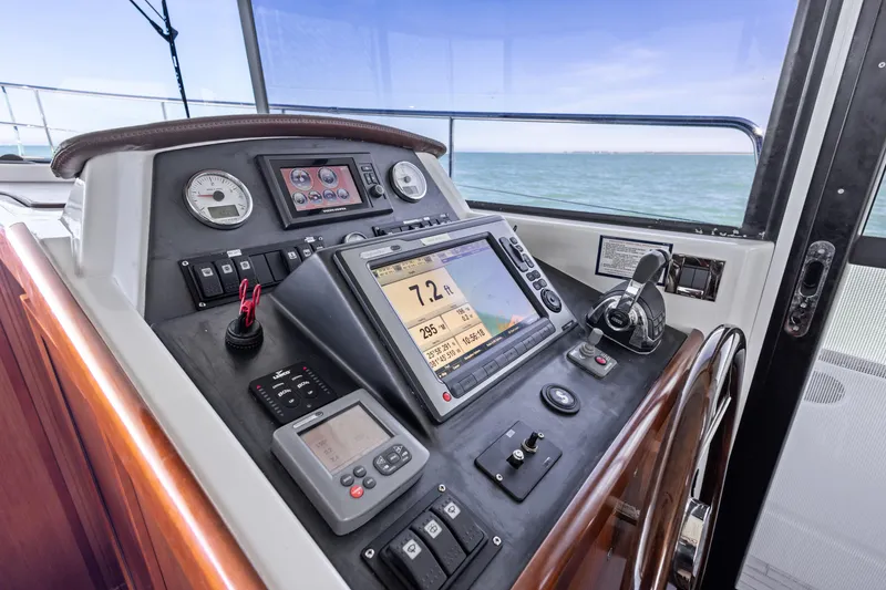 Slide: The Image of Beneteau Swift Trawler 44 helm with navigation instruments, 2012 model, ocean view. - 22