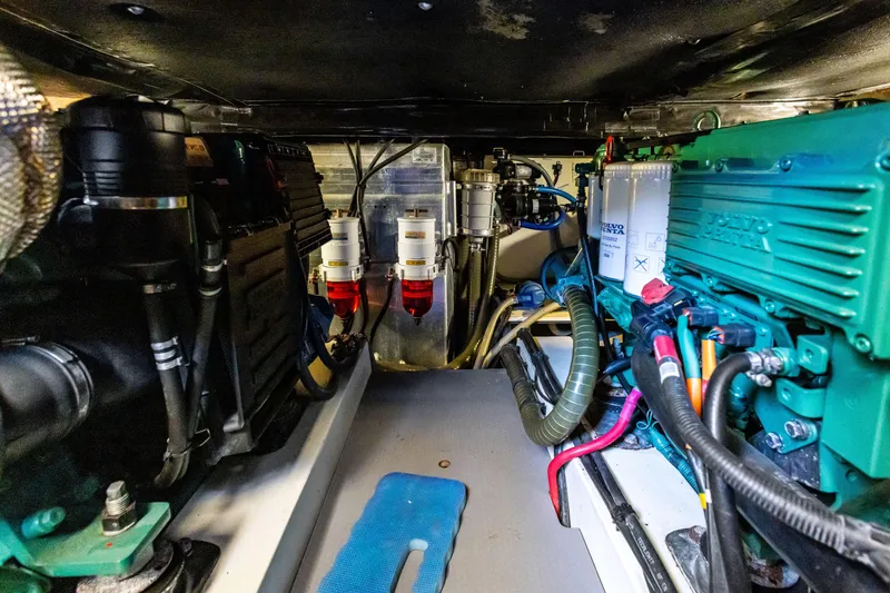 Slide: The Image of Engine room of 2012 Beneteau Swift Trawler 44, showcasing mechanical components and systems. - 28