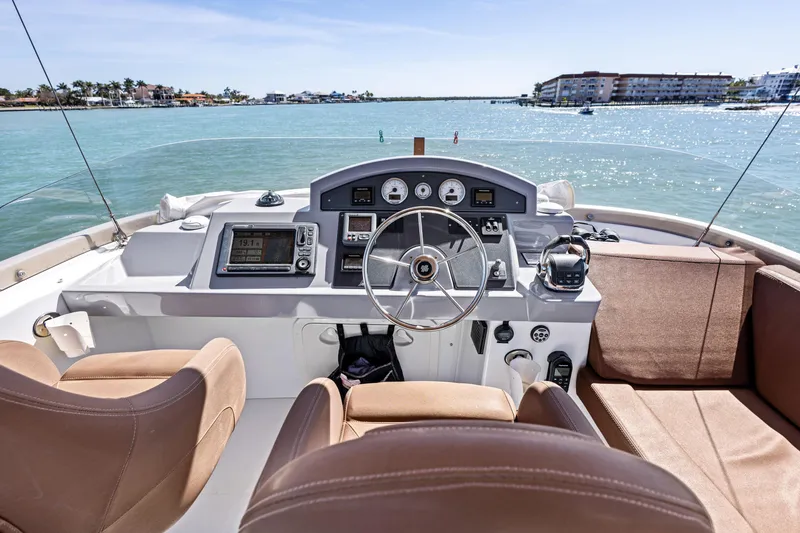 Slide: The Image of Helm of 2012 Beneteau Swift Trawler 44 with ocean view and modern controls. - 8
