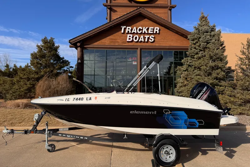 Slide: The Image of 2018 Bayliner Element E16 boat on trailer outside Tracker Boats store. - 0