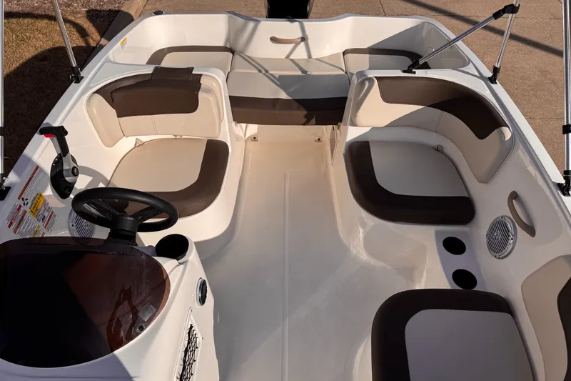 Slide: The Image of 2018 Bayliner Element E16 boat interior with seating and steering console. - 3