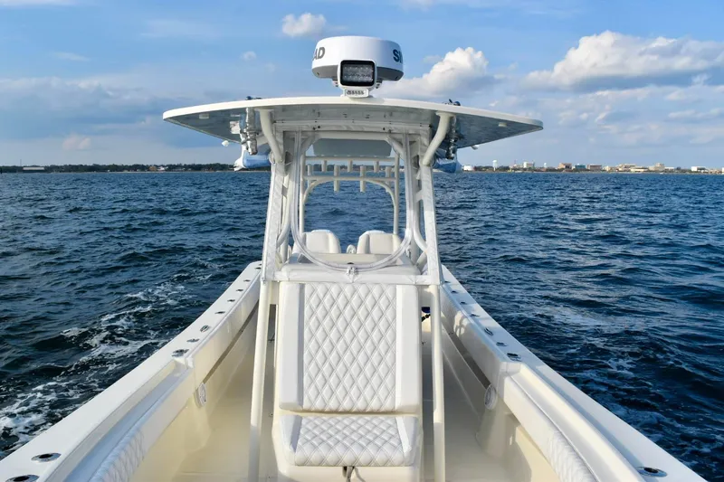 Slide: The Image of 2021 Panga Marine boat on open water, featuring a sleek design and modern equipment. - 12
