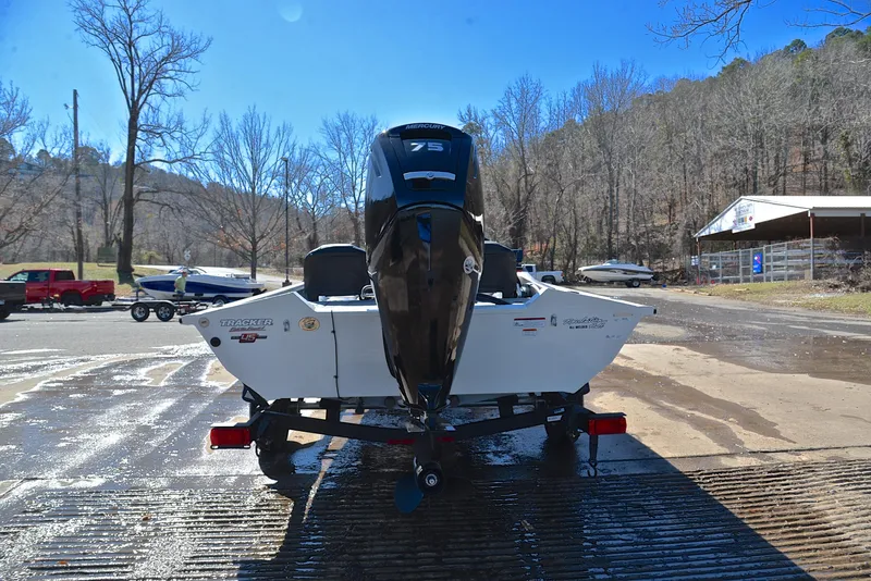 Slide: The Image of 2023 Bass Tracker PRO TEAM 175 TF boat on trailer at a boat ramp. - 13
