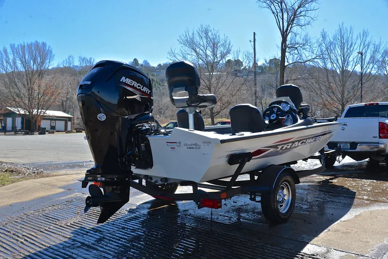 Slide: The Image of 2023 Bass Tracker PRO TEAM 175 TF boat on trailer, parked outdoors. - 14