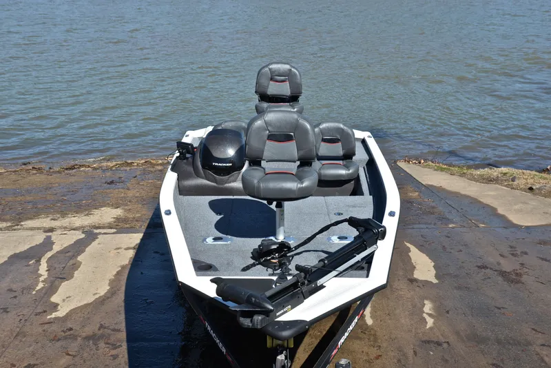 Slide: The Image of 2023 Bass Tracker PRO TEAM 175 TF boat at a lakeside launch. - 17